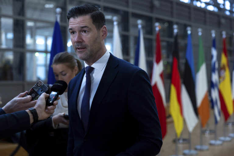 Swedish Minister for Migration and Asylum Policy Johan Forssell speaks with the media during arrivals for a meeting of EU justice and interior ministers at the European Council building in Brussels, Thursday, Dec. 12, 2024. (AP Photo/Omar Havana)