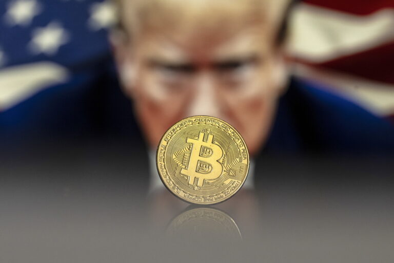 epa11780123 (FILE) - An illustration shows a Bitcoin mockup in front of an image of US President-elect Donald Trump, 22 November 2024 (reissued 16 December 2024). The world's most popular cryptocurrency hit a new record high on 16 December 2024, briefly passing 106,000 dollars (100,800 euros). EPA/PABLO GIANINAZZI