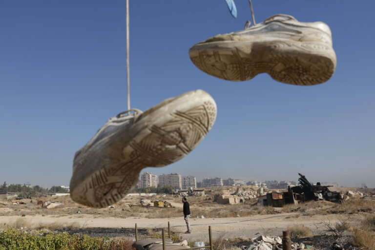 epa11781516 A man walks next to destroyed military vehicles at the Mezzeh Air Base on the outskirts of Damascus, Syria, 16 December 2024. After Syrian rebels ousted President Bashar al-Assad on 08 December 2024, the Israeli military carried out strikes throughout Syria to destroy what remained of the Assad regime's military arsenal. EPA/ANTONIO PEDRO SANTOS