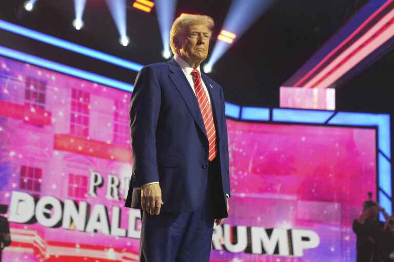 President-elect Donald Trump speaks at AmericaFest, Sunday, Dec. 22, 2024, in Phoenix. (AP Photo/Rick Scuteri)