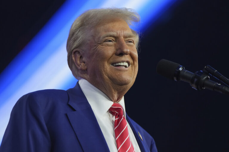 President-elect Donald Trump speaks at AmericaFest, Sunday, Dec. 22, 2024, in Phoenix. (AP Photo/Rick Scuteri)