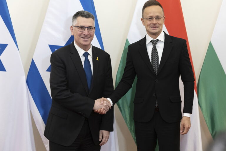 Hungarian Minister of Foreign Affairs and Trade Peter Szijjarto, right, shakes hands with Israeli Foreign Minister Gideon Sa'ar in his office in Budapest, Hungary, Thursday, Jan. 23, 2025. (Zoltan Kocsis/MTI via AP)