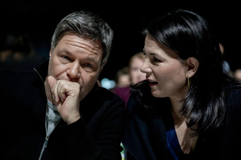 Green Party top candidate, federal minister for economy Robert Habeck, left, speaks with German Foreign Minister Annalena Baerbock at a party convention in, Berlin, Germany, Sunday, Jan. 26, 2025. (AP Photo/Ebrahim Noroozi)