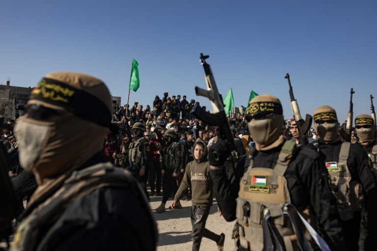 epa11863693 Palestinian civilians and militants gather for the release of hostages, as part of a ceasefire and prisoner exchange deal between Hamas and Israel, in Khan Younis, southern Gaza Strip, 30 January 2025. Hamas was set to free eight hostages on the day, with Israel releasing 110 Palestinian prisoners in exchange. This marks the third such exchange in the first phase of an Israeli-Hamas hostage release and ceasefire deal implemented on 19 January 2025. EPA/HAITHAM IMAD