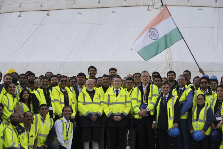 French President Emmanuel Macron, center right, and Indian Prime Minister Narendra Modi, center left, pose for a photo as they visit the ITER (International Thermonuclear Experimental Reactor) in Saint-Paul-les-Durance, southern France, Wednesday, Feb. 12, 2025. (AP Photo/Laurent Cipriani, Pool)