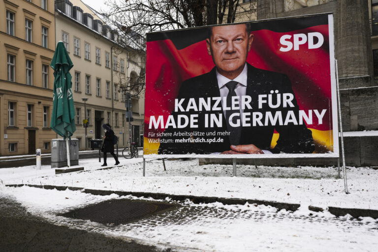 An election campaign poster of Germany's Social Democratic Party, SPD, with top candidate Chancellor Olaf Scholz for the upcoming national's election is displayed at a crossing in central Berlin, Germany, Thursday, Feb. 13, 2025. Slogan reads: 