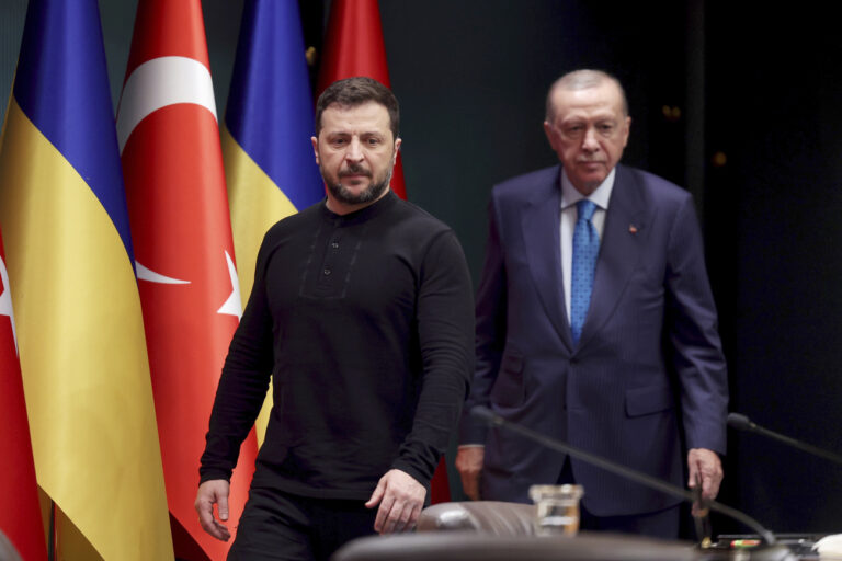 Turkish President Recep Tayyip Erdogan, right, and Ukrainian President Volodymyr Zelenskyy arrive for a joint news conference following their meeting at the presidential palace in Ankara, Turkey, Tuesday, Feb. 18, 2025. (Yavuz Ozden/Dia Photo via AP)