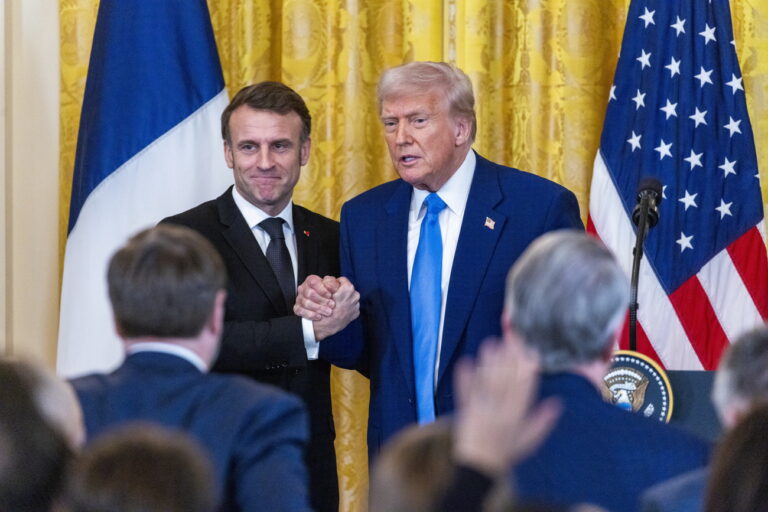 epa11922498 US President Donald Trump (C-R) and French President Emmanuel Macron (C-L) shake hands at the end of a joint press conference in the East Room to the White House in Washington, DC, USA, 24 February 2025. EPA/SHAWN THEW