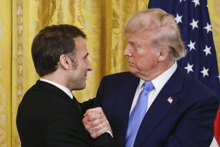 President Donald Trump, right, shakes the hand of France's President Emmanuel Macron during a joint press conference in the East Room of the White House in Washington, Monday, Feb. 24, 2025. (Ludovic Marin/Pool via AP)