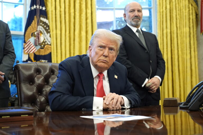 epa11924646 US President Donald Trump speaks to reporters alongside Secretary of Commerce Howard Lutnick (R) after signing Executive Orders in the Oval Office of the White House in Washington, DC, USA, 25 February 2025. EPA/YURI GRIPAS / POOL