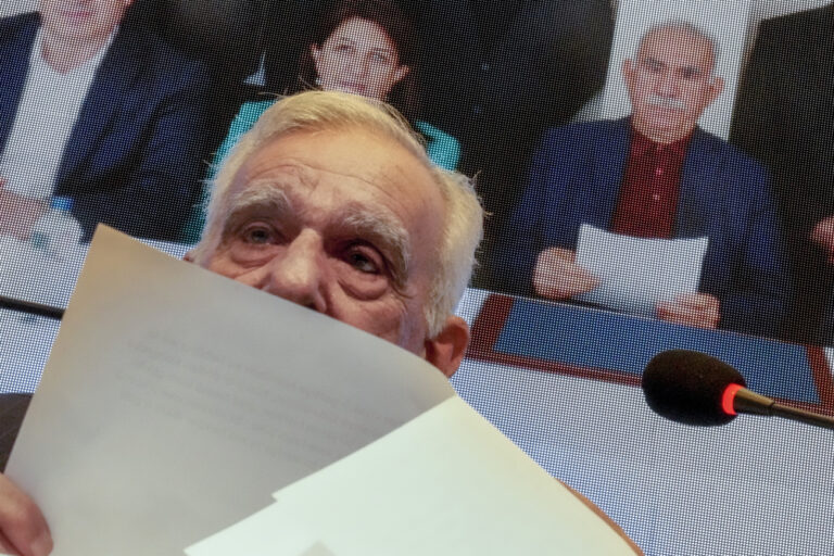 Ahmet Turk, a member of the pro-Kurdish Peoples' Equality and Democracy Party (DEM) delegation, reads a statement from jailed Kurdistan Workers' Party (PKK) leader Abdullah Ocalan, whose photo is seen in the background, during a press conference in Istanbul, Turkey, Thursday, Feb. 27, 2025. (AP Photo/Khalil Hamra)