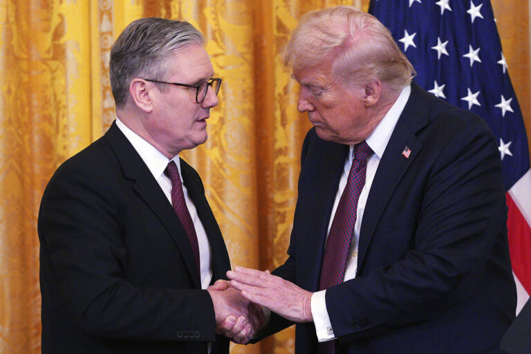 Britain's Prime Minister Keir Starmer, left, and U.S. President Donald Trump shake hands at a joint press conference in the East Room at the White House Thursday, Feb. 27, 2025, in Washington. (Carl Court/Pool Photo via AP)