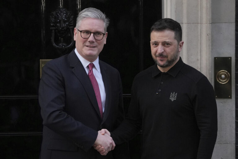 Britain's Prime Minister Keir Starmer, left, greets Ukraine's President Volodymyr Zelenskyy on the doorstep of 10 Downing Street in London Saturday, March 1, 2025. (AP Photo/Kin Cheung)