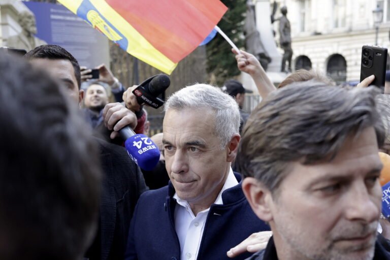 epa11947168 The independent candidate supported by ultra-nationalist AUR party Calin Georgescu (L), who won the first round of Romania's annulled presidential elections, arrives at the Central Election Bureau (BEC) to register his candidacy for presidential elections in Bucharest, Romania, 07 March 2025. Former independent presidential candidate Calin Georgescu was questioned by prosecutors on 26 February 2025 as part of an investigation into election campaign fraud, including actions against the constitutional order and false statements about campaign financing. A judge from the Prosecutor General's Office imposed a judicial control measure, which Georgescu appealed. Romanians will vote in the first round of the presidential elections on 4 May 2025. EPA/ROBERT GHEMENT