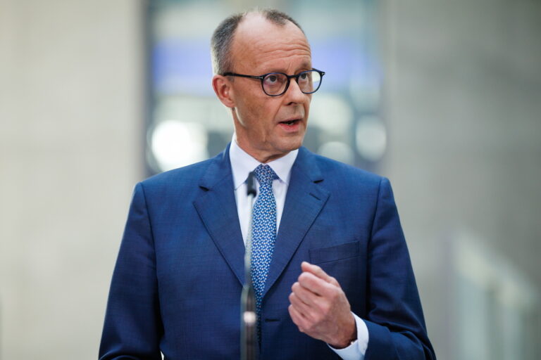 epa11949349 Chairman of the Christian Democratic Union (CDU) party and faction Friedrich Merz gestures at a press conference during ongoing exploratory talks on the premises of the German parliament, the Bundestag, in Berlin, Germany, 08 March 2025. Germany's Christian Democratic Union (CDU) and Social Democratic Party (SPD) continue exploratory talks on forming a potential governing coalition. EPA/CLEMENS BILAN