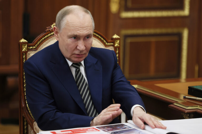 Russian President Vladimir Putin speaks with the governor of Arkhangelsk region Alexander Tsybulsky during their meeting at the Kremlin in Moscow, Russia, Tuesday, March 11, 2025. (Mikhail Metzel, Sputnik, Kremlin Pool Photo via AP)