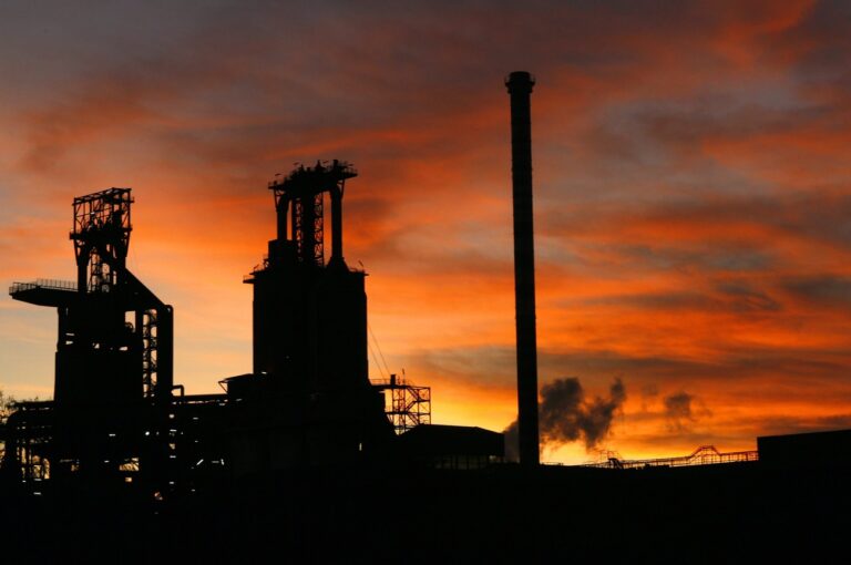 epa01946834 Picture taken on 20 November 2009 shows the sun setting down behind two blast furnace of ThyssenKrupp's in the Duisburg suburb of Marxloh. The largest German steel group ThyssenKrupp in Essen's Villa Huegel is set to announce the worst record year in the company history on 27 November 2009. Two weeks earlier, ThyssenKrupp's CEO Schulz had reported an estimated pre-tax loss of more than 2.3 billion Euros. EPA/ROLAND WEIHRAUCH