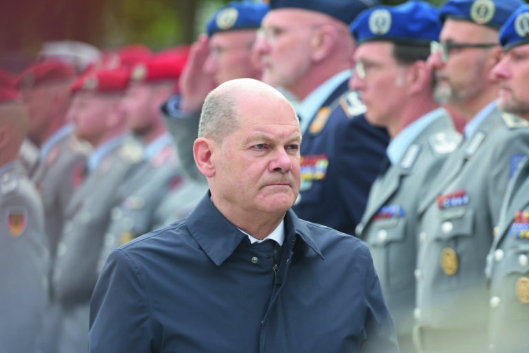 epa11272995 German Chancellor Olaf Scholz walks in front of soldiers at the defense ministry on the occasion of the final muster of the German Bundeswehr to honor the Mali mission in Berlin, Germany, 11 April 2024. The German Armed Forces (Bundeswehr) ended its foreign deployment for the United Nations in Mali after ten years. The last remaining soldiers arrived on 15 December 2023 at the German airbase Wunstorf. EPA/CLEMENS BILAN