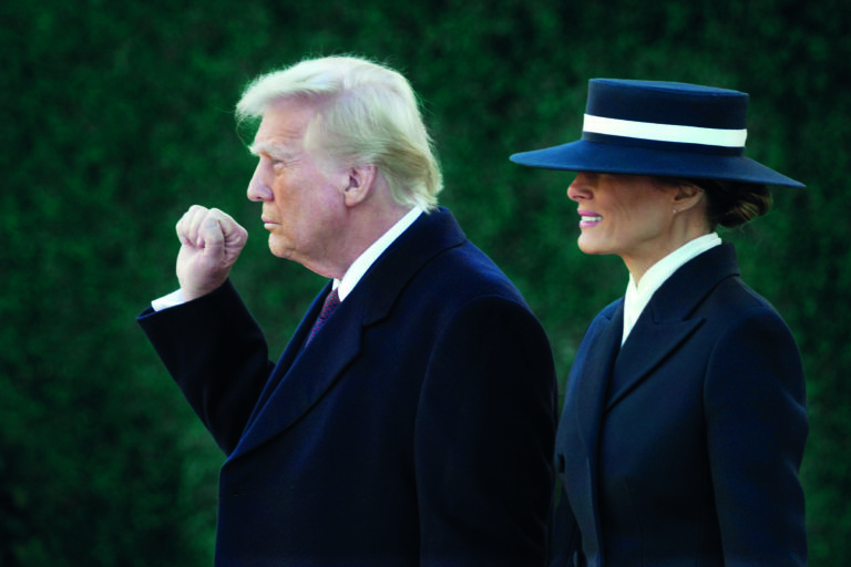 President-elect Donald Trump gestures as he walks with his wife Melania after a church service at St. John's Episcopal Church across from the White House in Washington, Monday, Jan. 20, 2025, on Donald Trump's inauguration day. (AP Photo/Matt Rourke)